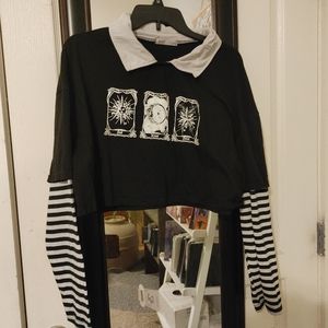 Large black collared crop top with striped sleeves and sun moon stars decal